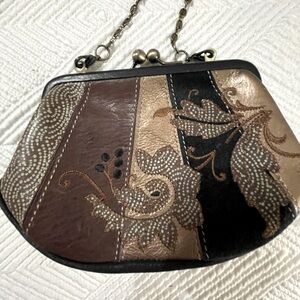 Fossil embroidered clutch